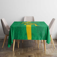 Green football tablecloth with yellow stripe and lion-like mascot crest
