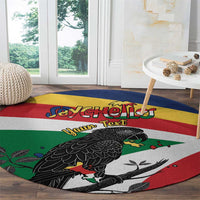 Round rug on floor with flag stripes, black parrot, and text