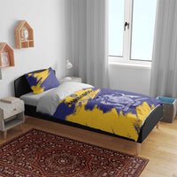 Blue and yellow Barbados-themed duvet with two pillows on single bed