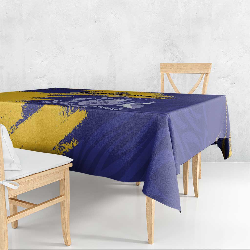 Tablecloth close-up on dining table, blue and yellow flag-style coat of arms