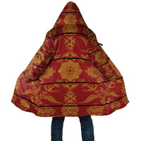 Red hooded cloak blanket with gold decorative pattern, draped poncho style