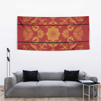 Red and gold tapestry blanket with ornate traditional motifs and banded layout