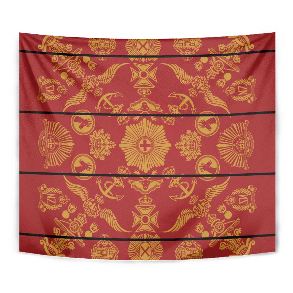 Close-up of red and gold patterned tapestry blanket with star and emblem motifs