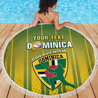 Round Dominica cricket beach blanket with green-yellow stripes, white fringe, printed crest