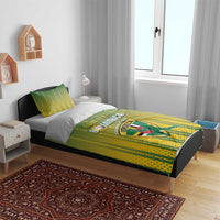 Dominica cricket bedding set on bed with green/yellow striped duvet and matching pillows