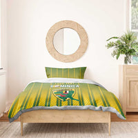 Dominica cricket bedding set with green/yellow striped duvet and two pillowcases on wooden bed