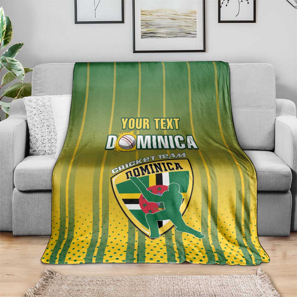 Cricket blanket folded on sofa, green and yellow stripes with Dominica team logo