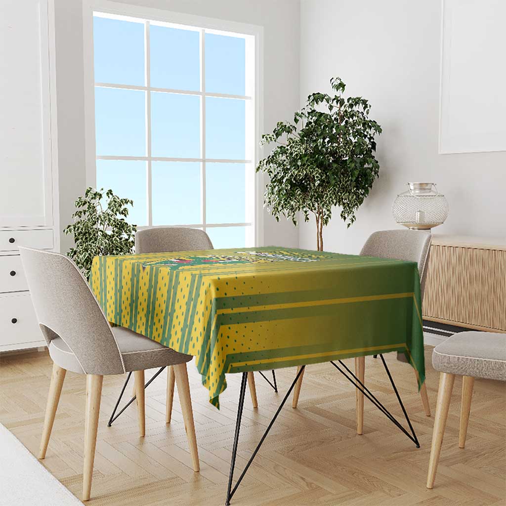 Green and yellow cricket tablecloth covering a dining table with chairs