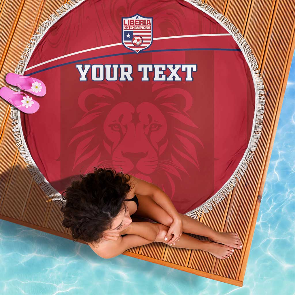 Red round beach blanket with white fringe, Liberia crest and 'YOUR TEXT' over lion graphic.