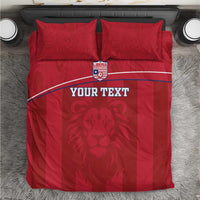 Red bedding set with Liberia lion crest, white stripe, and two matching pillowcases