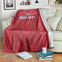 Red football blanket with Liberia crest, lion motif, and custom text across front