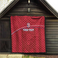 Red quilted football blanket displayed with Liberia crest and 'YOUR TEXT' curved stripe.