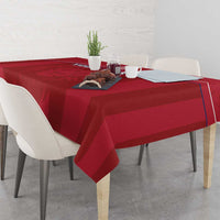 Red football tablecloth draped on dining table with Liberia lion mascot emblem