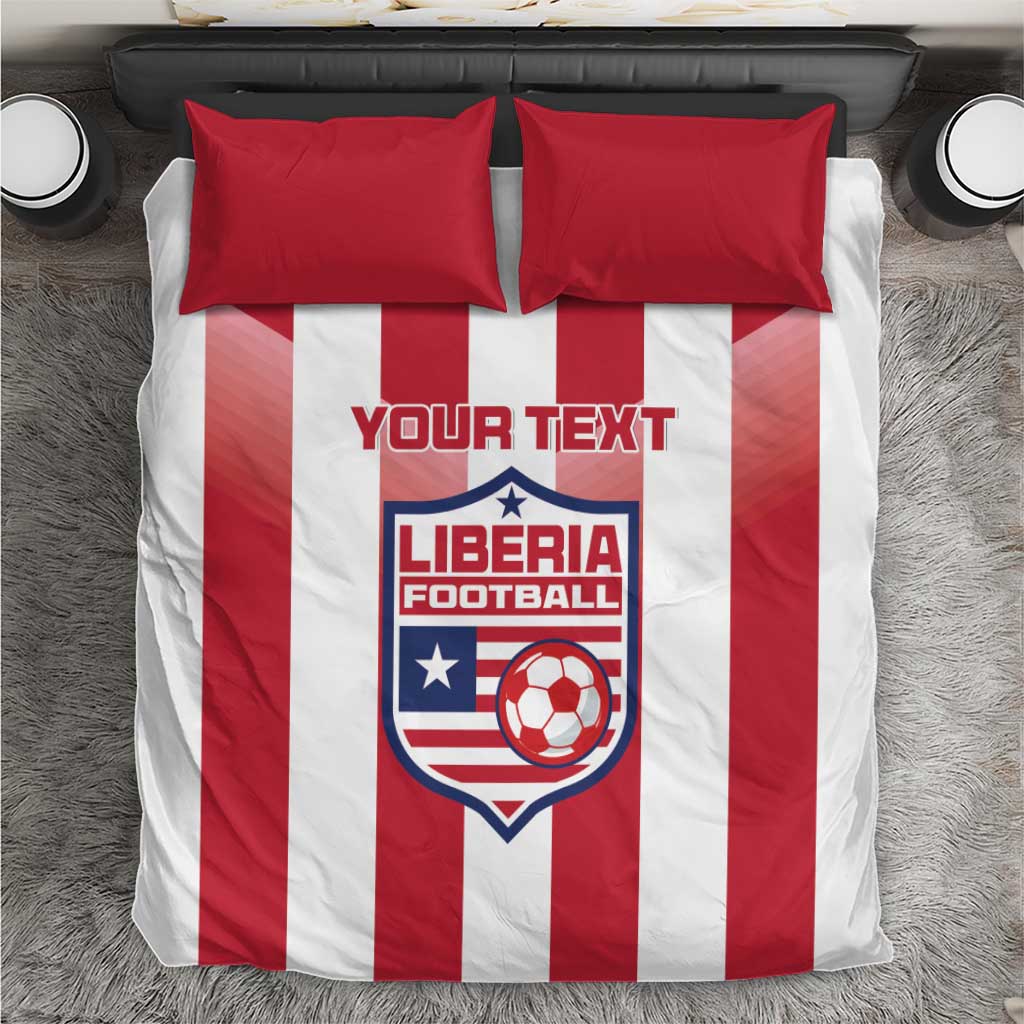 Red and white striped bedding set with two red pillows and Liberia Football crest