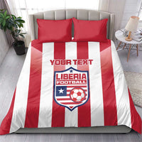 Red and white striped duvet set with two red pillowcases featuring Liberia Football crest
