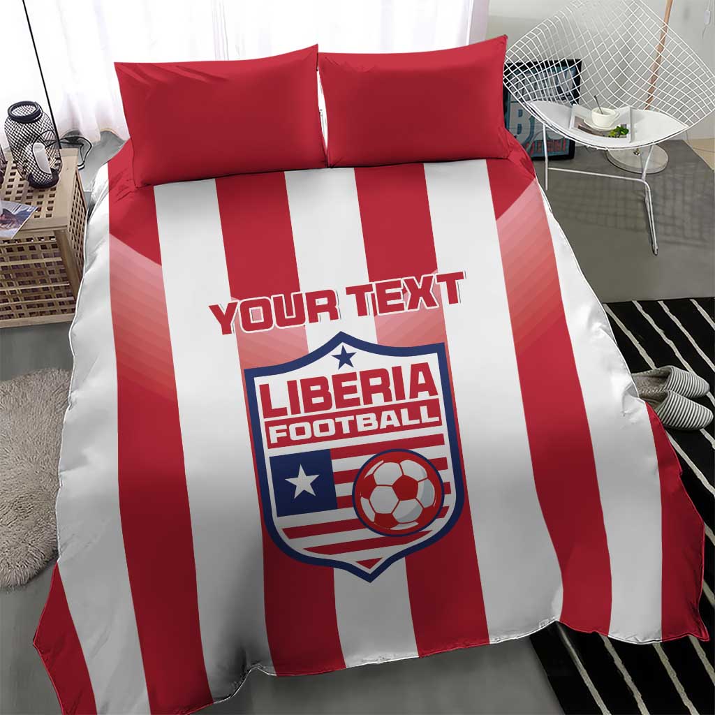 Red and white striped bedding set with two red pillows and Liberia Football logo