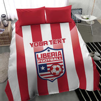Red and white striped bedding set with two red pillows and Liberia Football logo