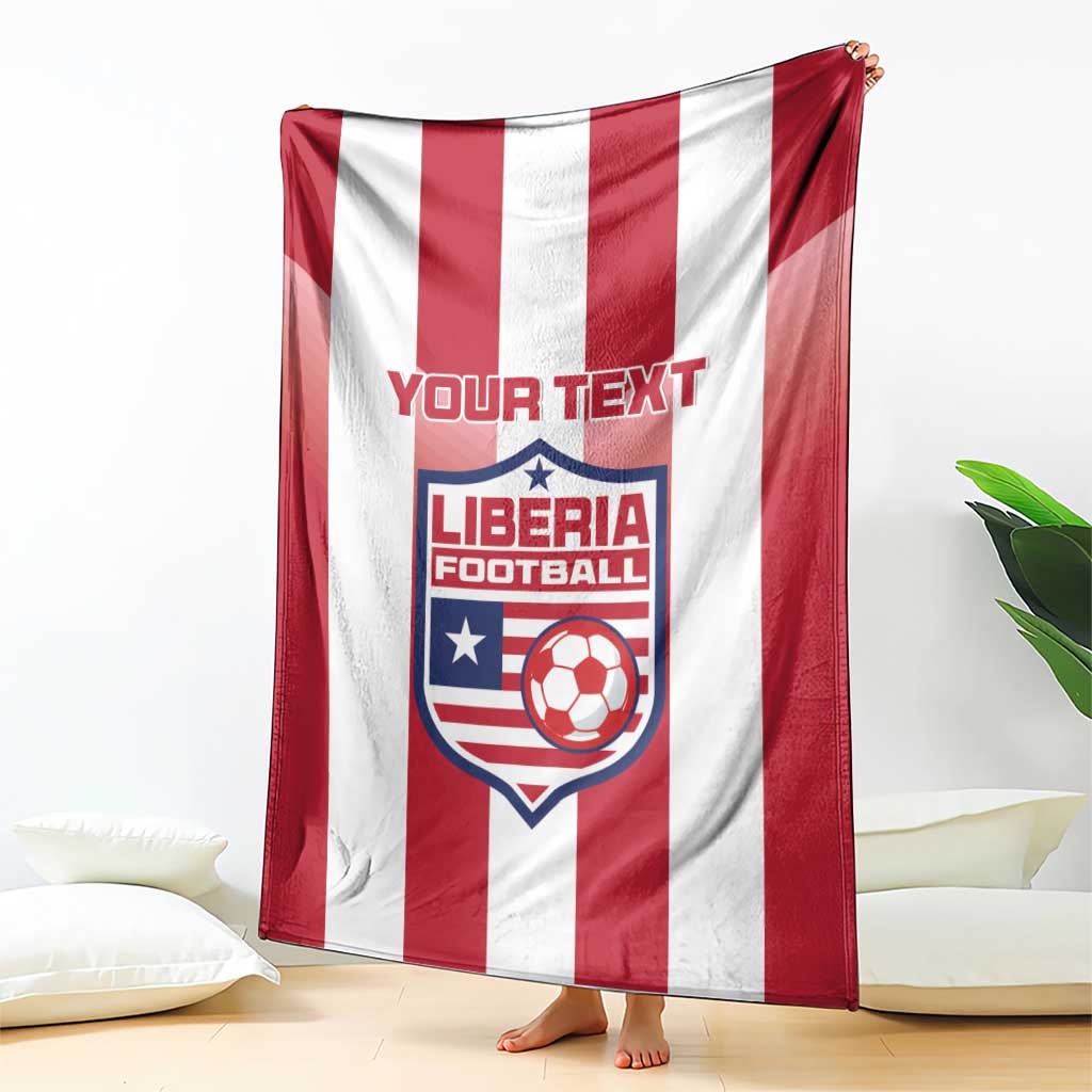 Red-and-white striped football blanket with Liberia crest and custom text, hanging