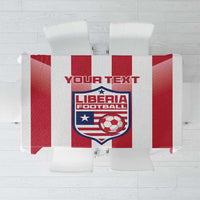 Red and white striped football tablecloth with Liberia crest centered on top.