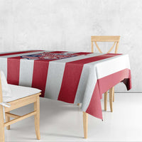 Red and white striped football tablecloth with crest panel, table edge drape.