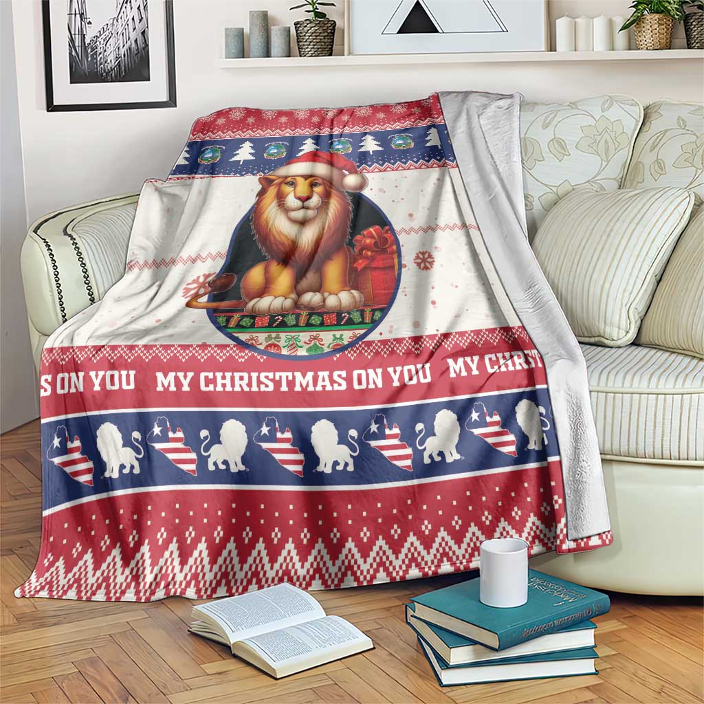 Christmas blanket with Lion Santa graphic, red white and blue holiday border pattern