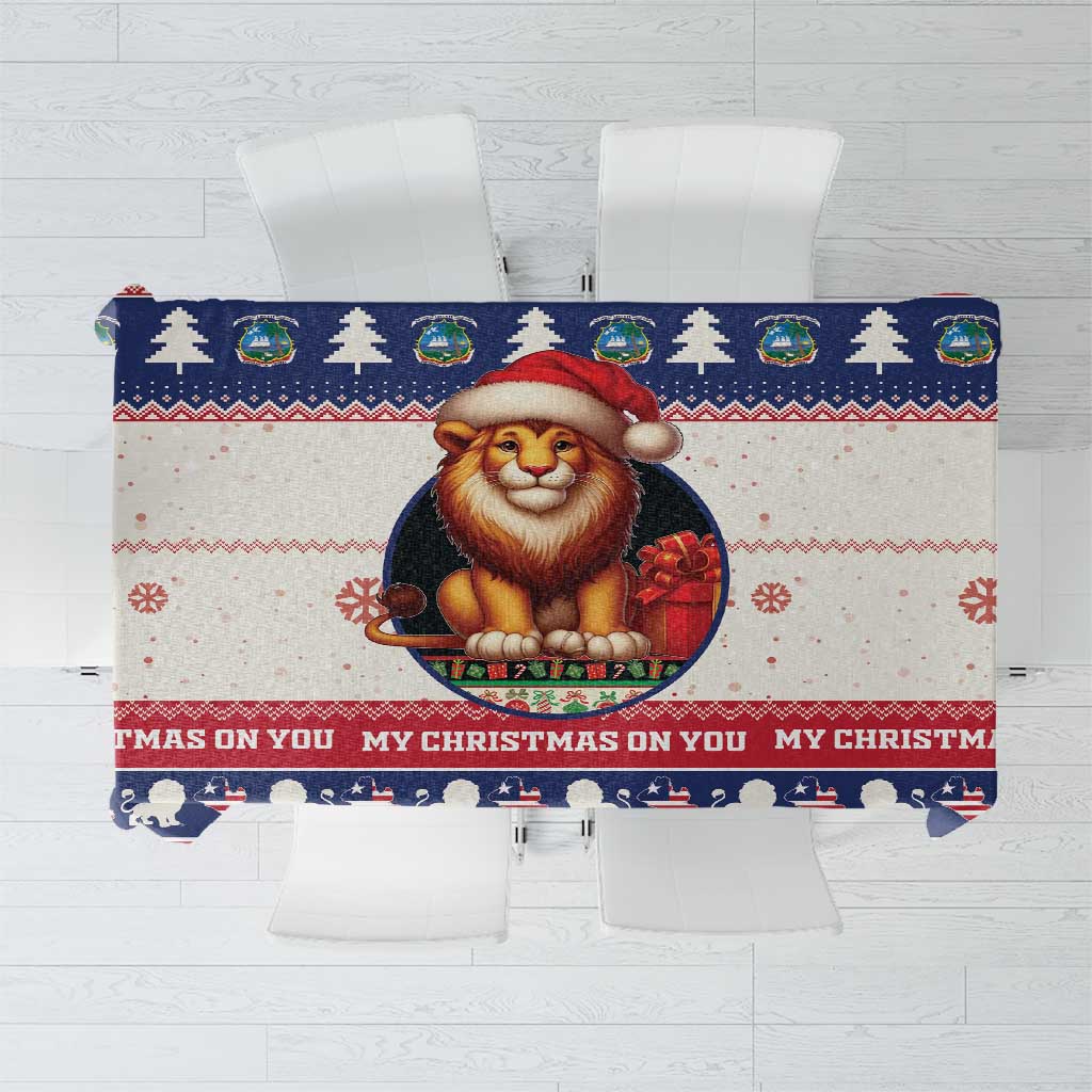 Red and navy Christmas tablecloth with lion Santa graphic and striped holiday border