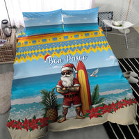 Blue Christmas duvet with surfing Santa, Bon Pasco script, pineapples and poinsettias