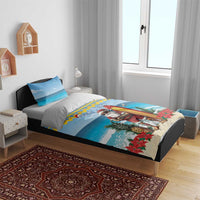 Blue Christmas duvet with surfboard Santa, Bon Pasco script, poinsettias and pineapples