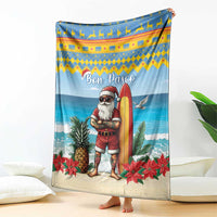 Blue Christmas blanket with surfer Santa holding a surfboard, pineapples and poinsettias