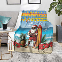 Blue Christmas blanket on floor over throws, surfer Santa with surfboard and poinsettias