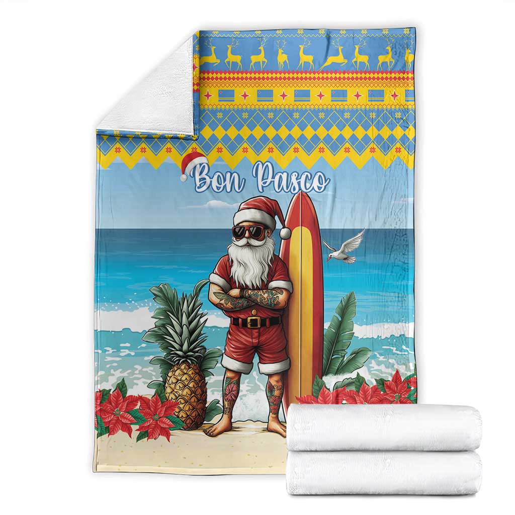 Blue Christmas blanket with surfer Santa and surfboard, shown with folded white towels