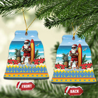 Pair of blue ceramic ornaments shaped like scalloped bells; Santa surfing “Bon Pasco” and “Land Aruba”.