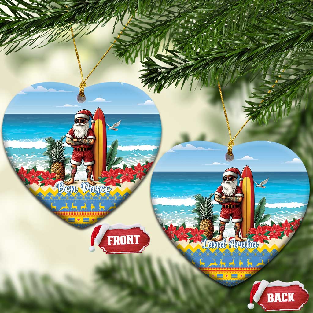 Two blue heart-shaped ceramic ornaments with Santa surfing; “Bon Pasco” and “Land Aruba” text.