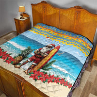 Blue bed quilt with surfing Santa illustration, “Bon Pasco” and red poinsettia border