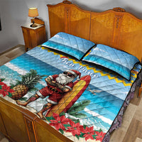 Blue quilt bed set with Surfing Santa print, pineapples, poinsettias, and Bon Pasco script