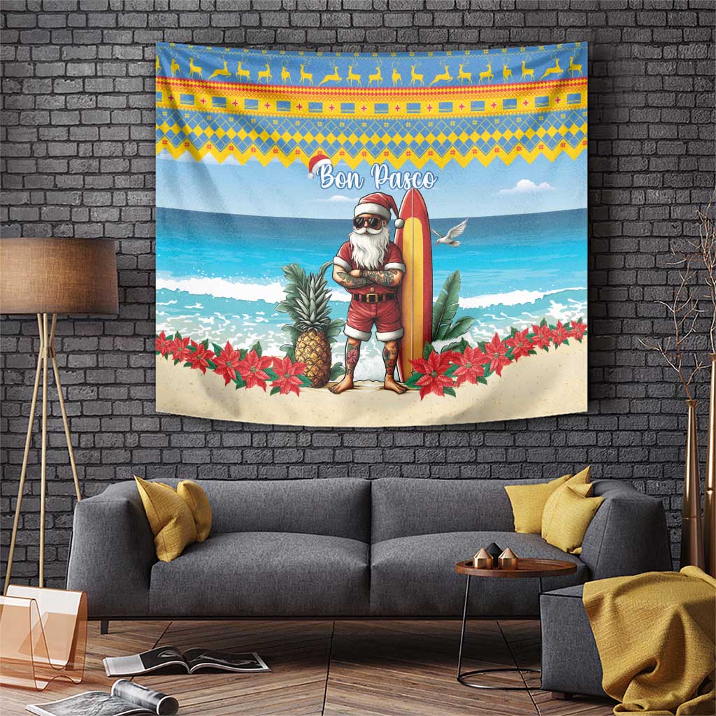 Christmas beach tapestry featuring Santa holding a surfboard, surrounded by plants and red flowers.