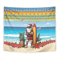 Christmas beach tapestry close-up: Santa holding a surfboard with "Bon Pasco" above.