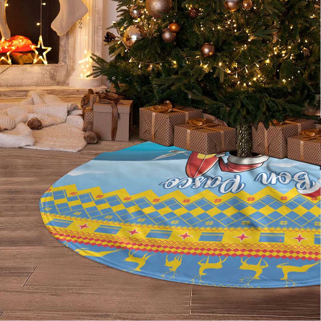 Blue round Christmas tree skirt with surfing Santa and 'Bon Pasco' graphic, blue-yellow pattern