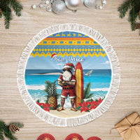 Blue round Christmas tree skirt with surfing Santa, 'Bon Pasco' text, white fringed border