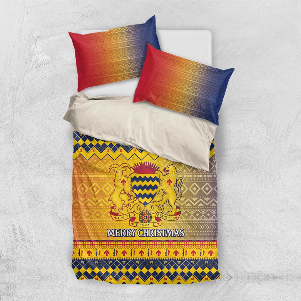 Christmas duvet and pillow set in red, blue, and gold with crest emblem and “Merry Christmas”