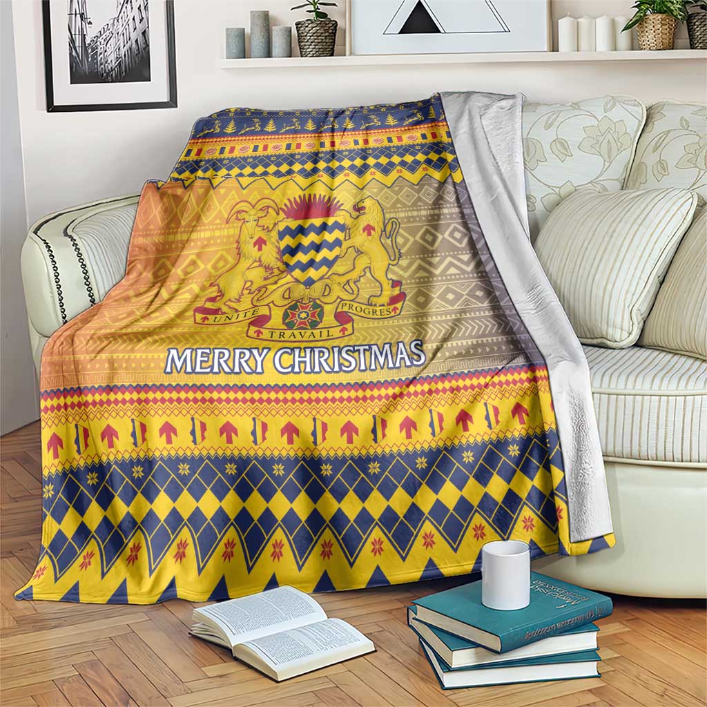Christmas throw blanket draped over a couch with lion crest and “Merry Christmas”