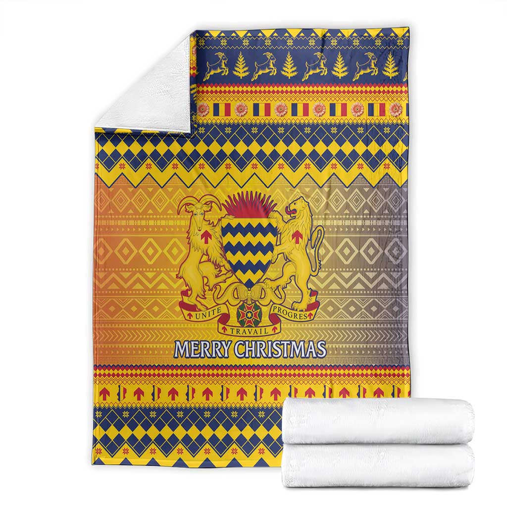 Folded Christmas blanket with lion crest and “Merry Christmas” in blue, gold, orange, gray