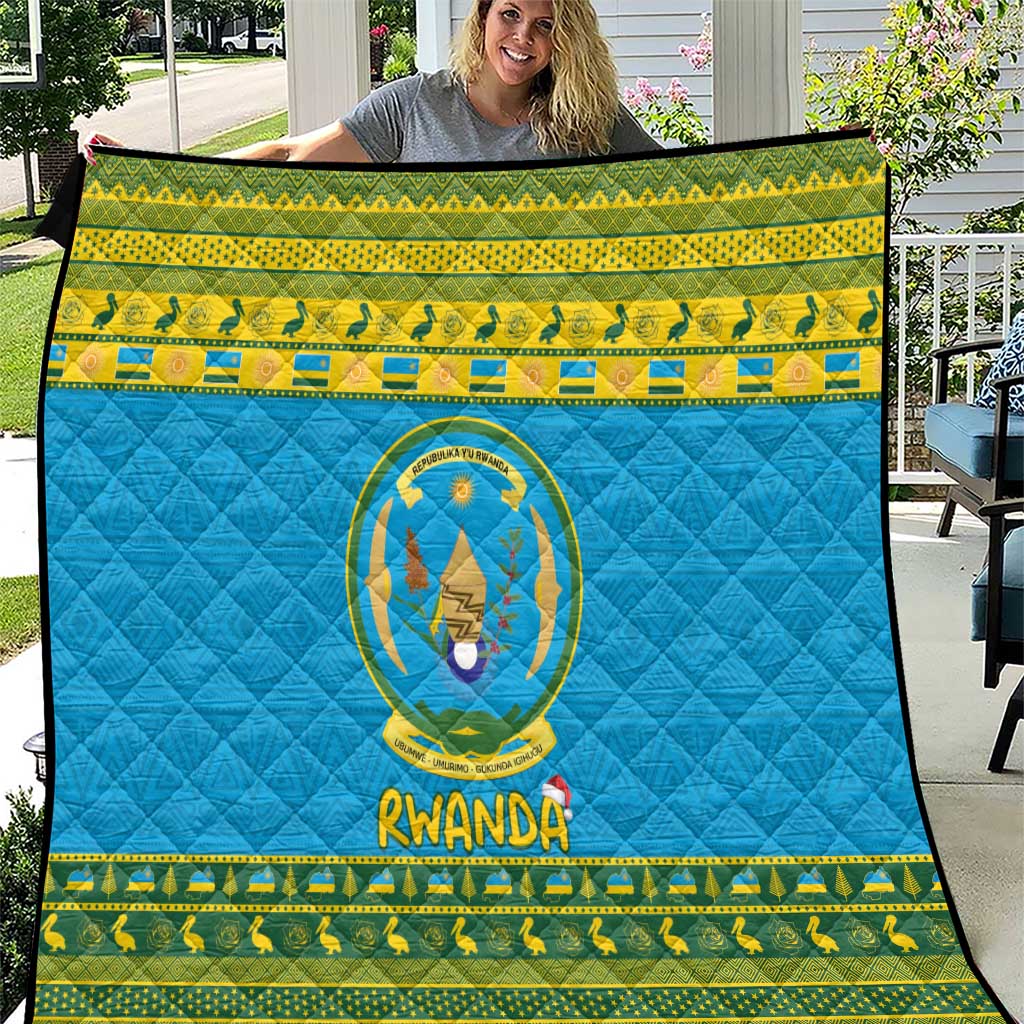 Rwanda quilt blanket with blue field, green-yellow border, crest medallion and "RWANDA" text