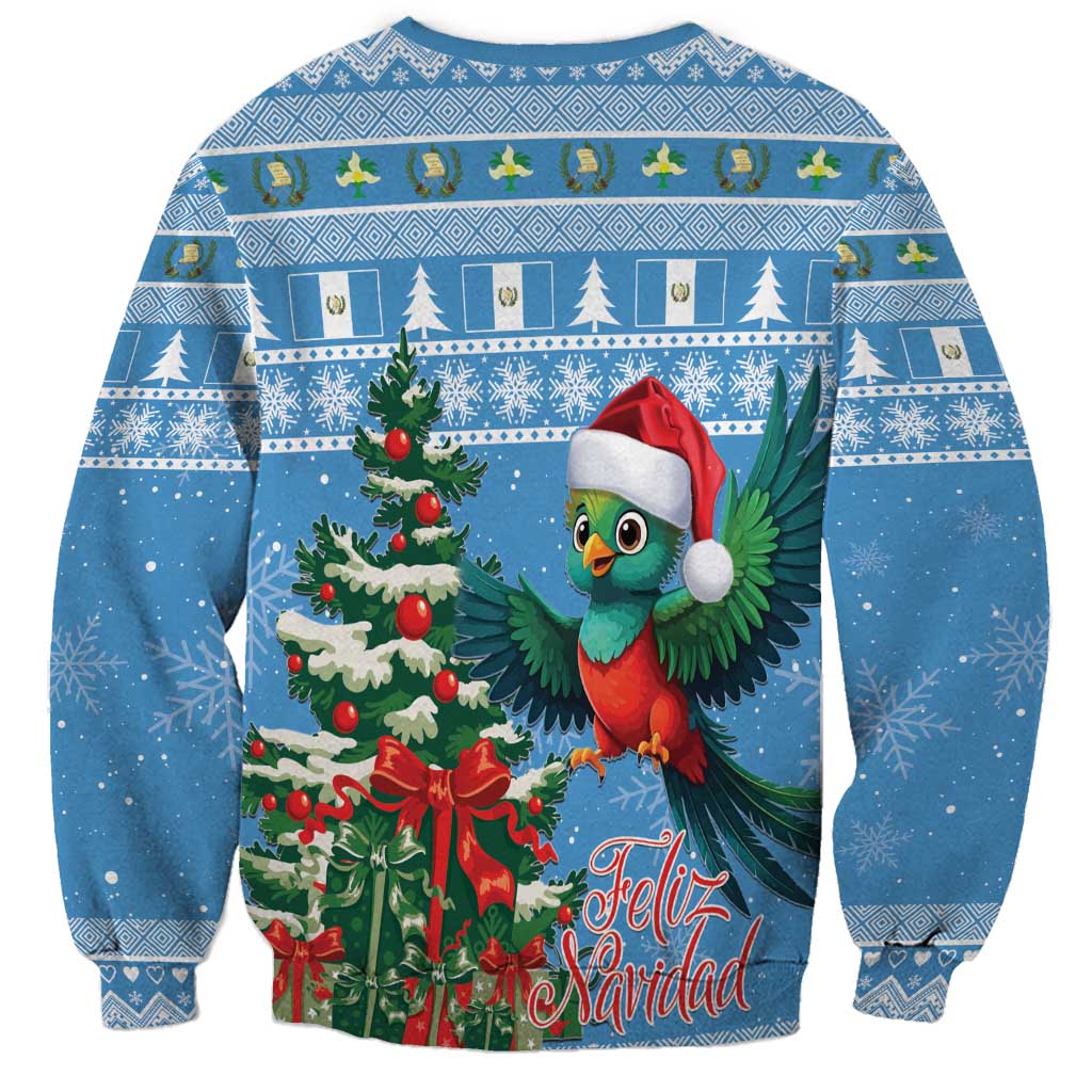 Blue holiday sweatshirt with quetzal bird, wreath, pine trees, and Feliz Navidad lettering