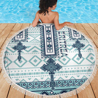 Round beach blanket with teal and navy Eritrea-style cross tile pattern, white fringe
