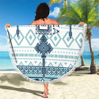 Round beach blanket wrap, white with teal geometric cross tile pattern, tassel fringe