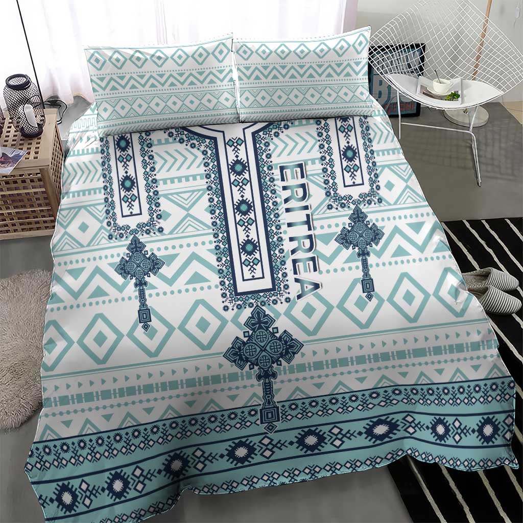 Teal and white geometric bedding set with central cross medallion and patterned borders