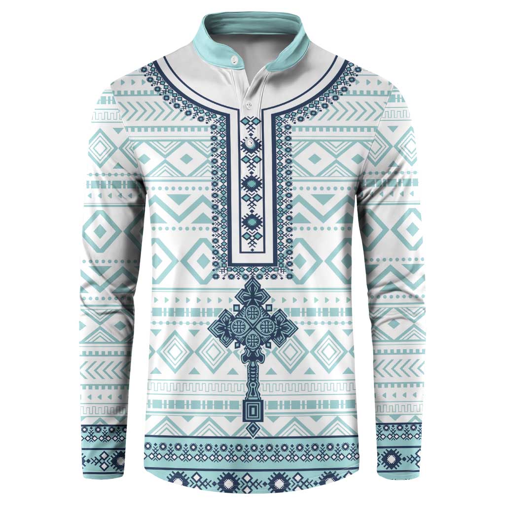 Teal and white patterned button sweatshirt with navy trim and long sleeves