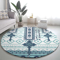 Round rug with turquoise and navy geometric border and centered ERITREA motif