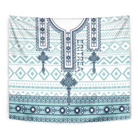Close-up Eritrean cross tile tapestry with vertical teal motifs and dark-blue trim